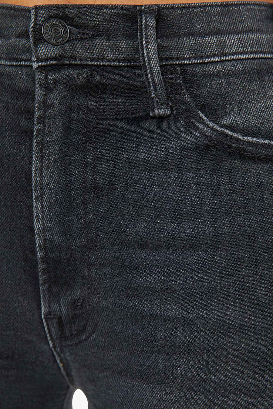 Front zoom in view of a person wearing a washed black, wide leg, high rise, and clean hem jean