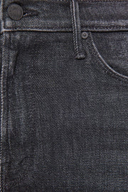 Close-up of black denim fabric with stitching details