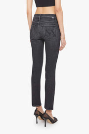 Person wearing black jeans and a black top on a white background