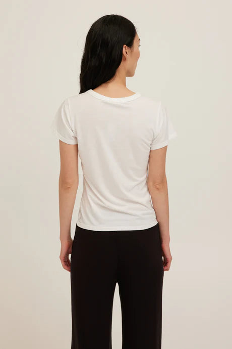 White baby tee with a crew neckline made with soft jersey cotton