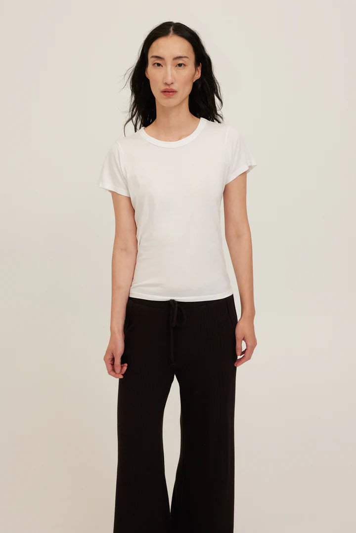 White baby tee with a crew neckline made with soft jersey cotton