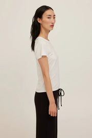White baby tee with a crew neckline made with soft jersey cotton