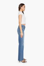 woman wearing mid rise boot cut light wash jeans 
