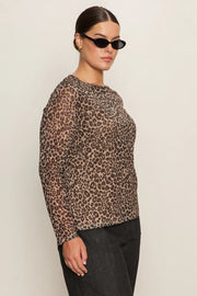 Side view of woman wearing a lined long sleeve leopard print mesh top