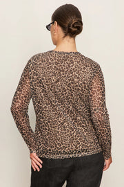 Back view of woman wearing a lined long sleeve leopard print mesh top