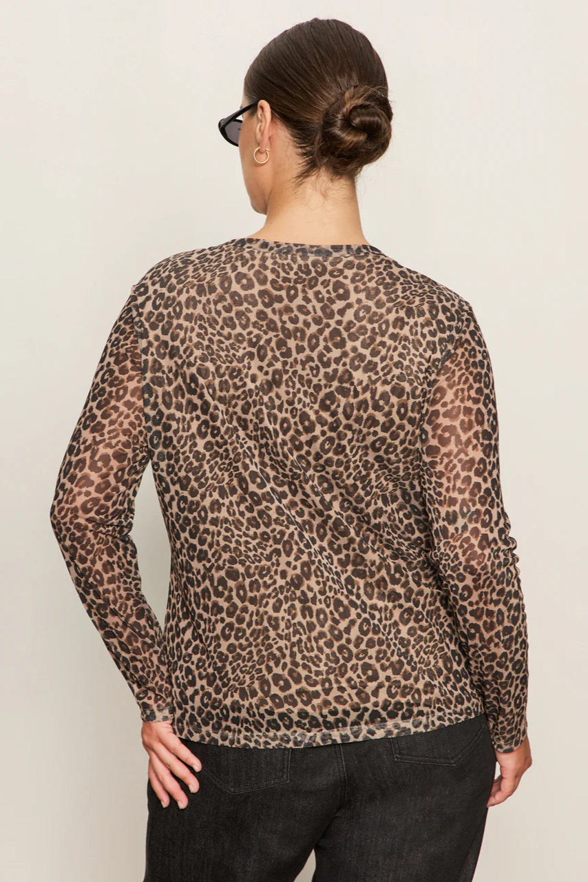 Back view of woman wearing a lined long sleeve leopard print mesh top