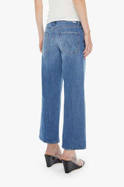 back view of woman wearing wide leg mid rise washed blue denim