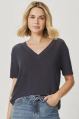 Woman wearing a v neck tee shirt in dark grey