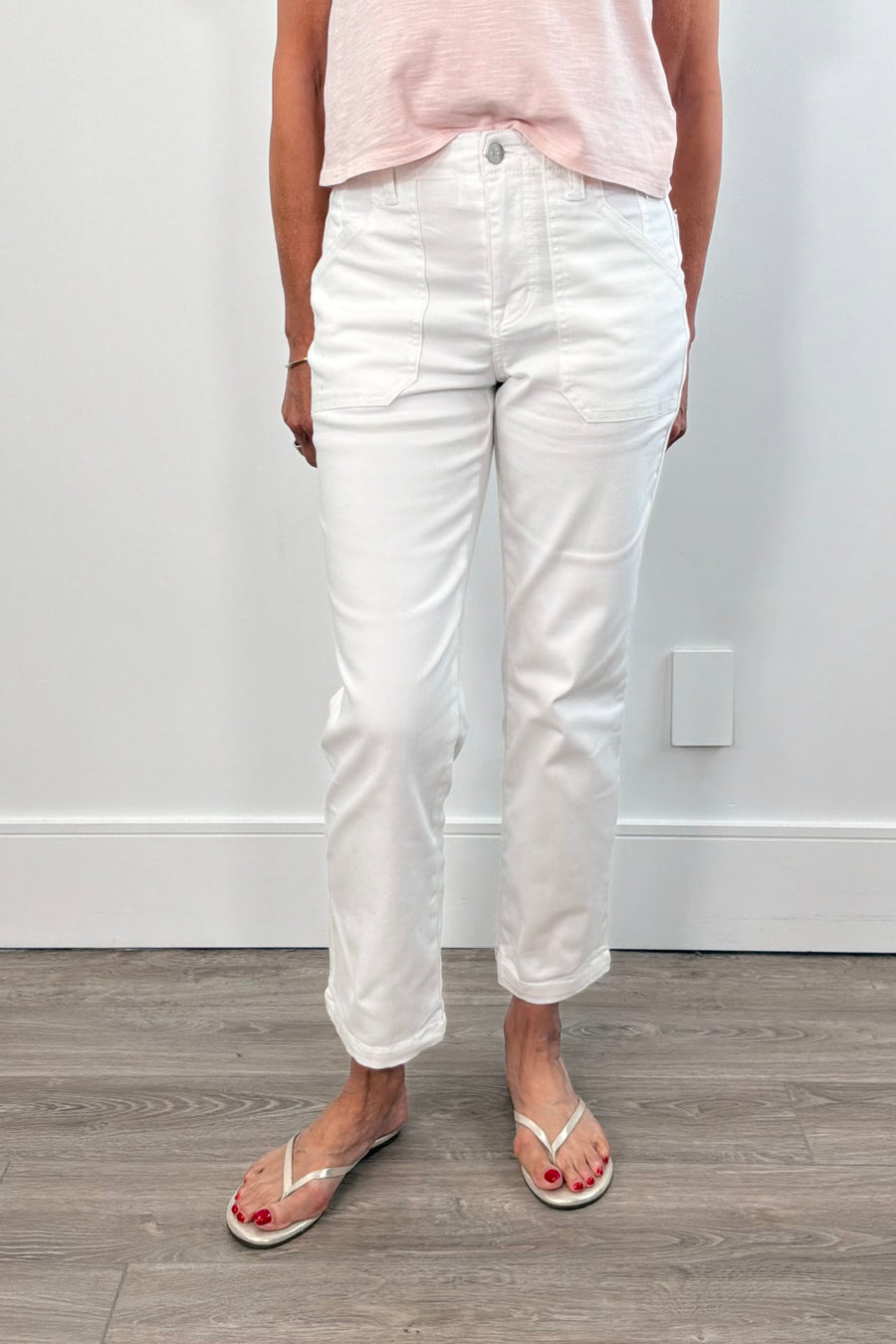 Person wearing white pants with large front pockets