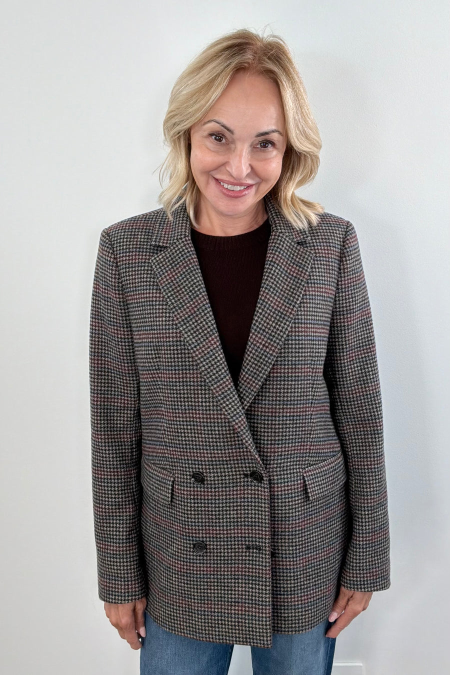 Woman wearing a checkered blazer