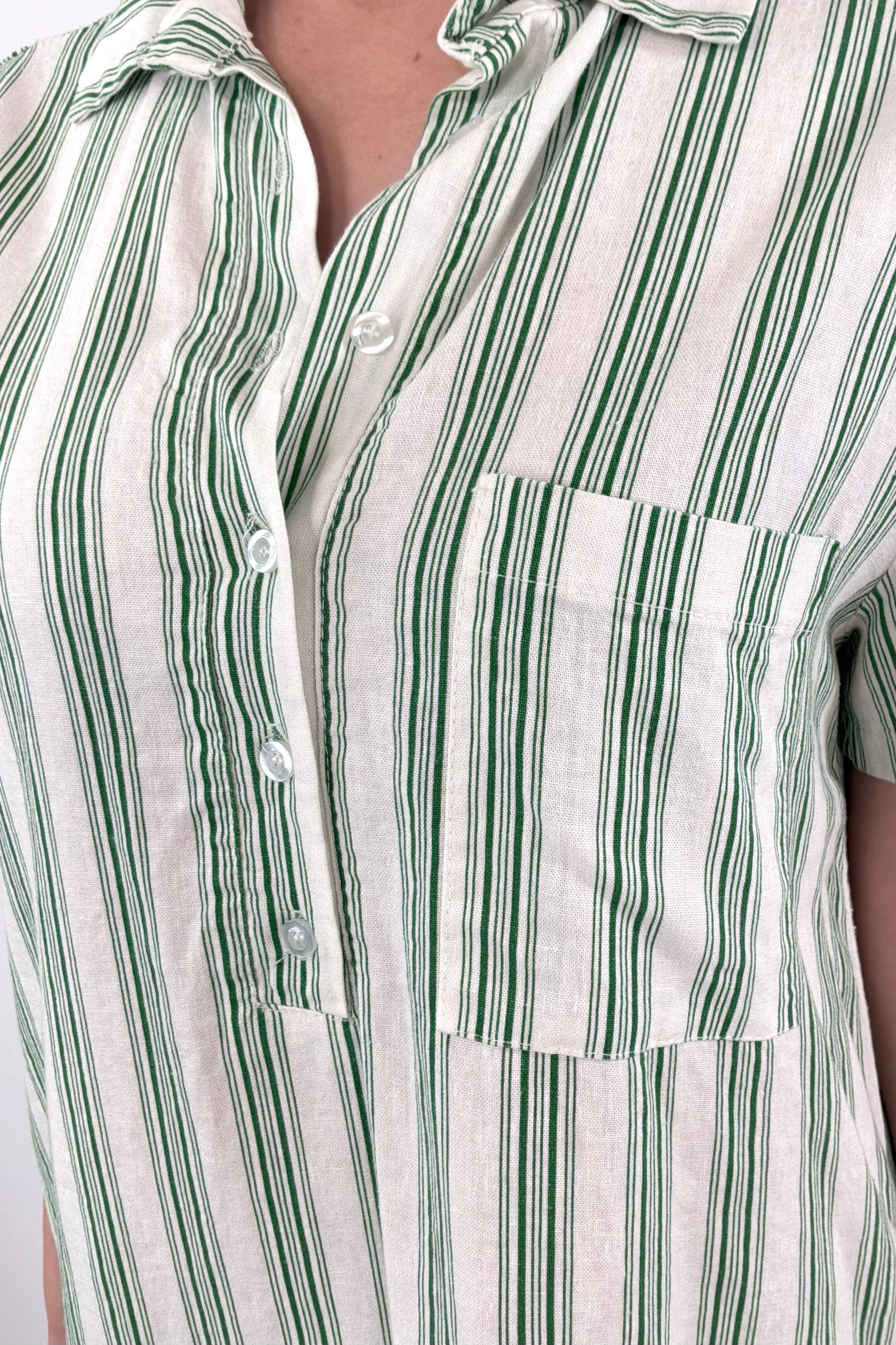 Close-up of women wearing a light green and white shirt dress with collar