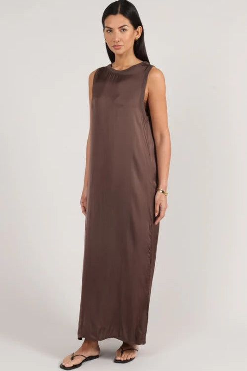 Sleeveless brown maxi dress with a relaxed fit, round neckline, and side slit detail, front