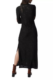 Black lace dress with a high slit on a white background