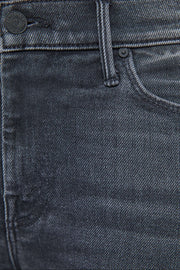 Close-up of washed black jeans with stitching details