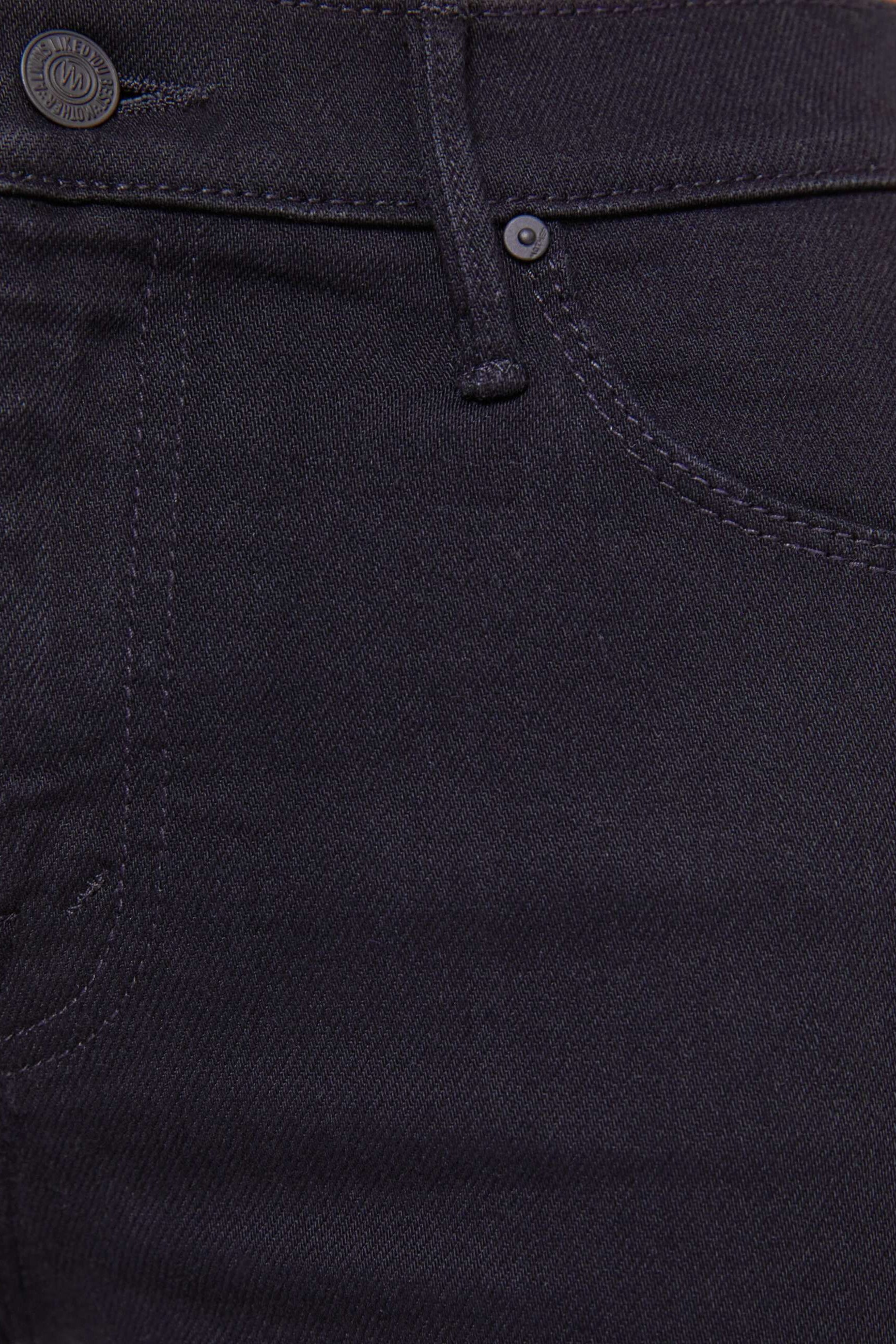 Close-up pocket of black denim jeans