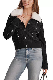 woman wearing black embellished cardigan