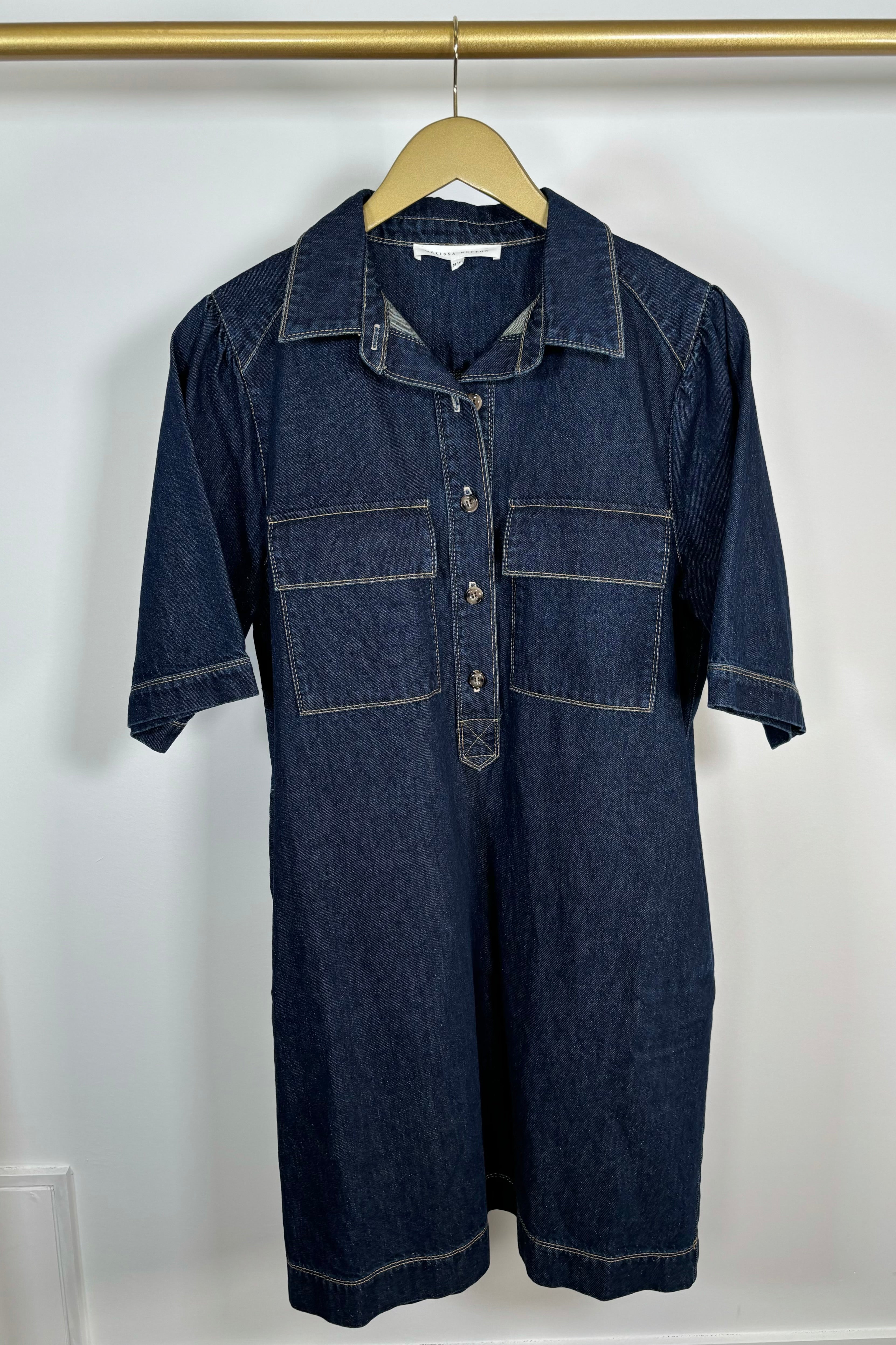 Front view of a dark blue denim dress 