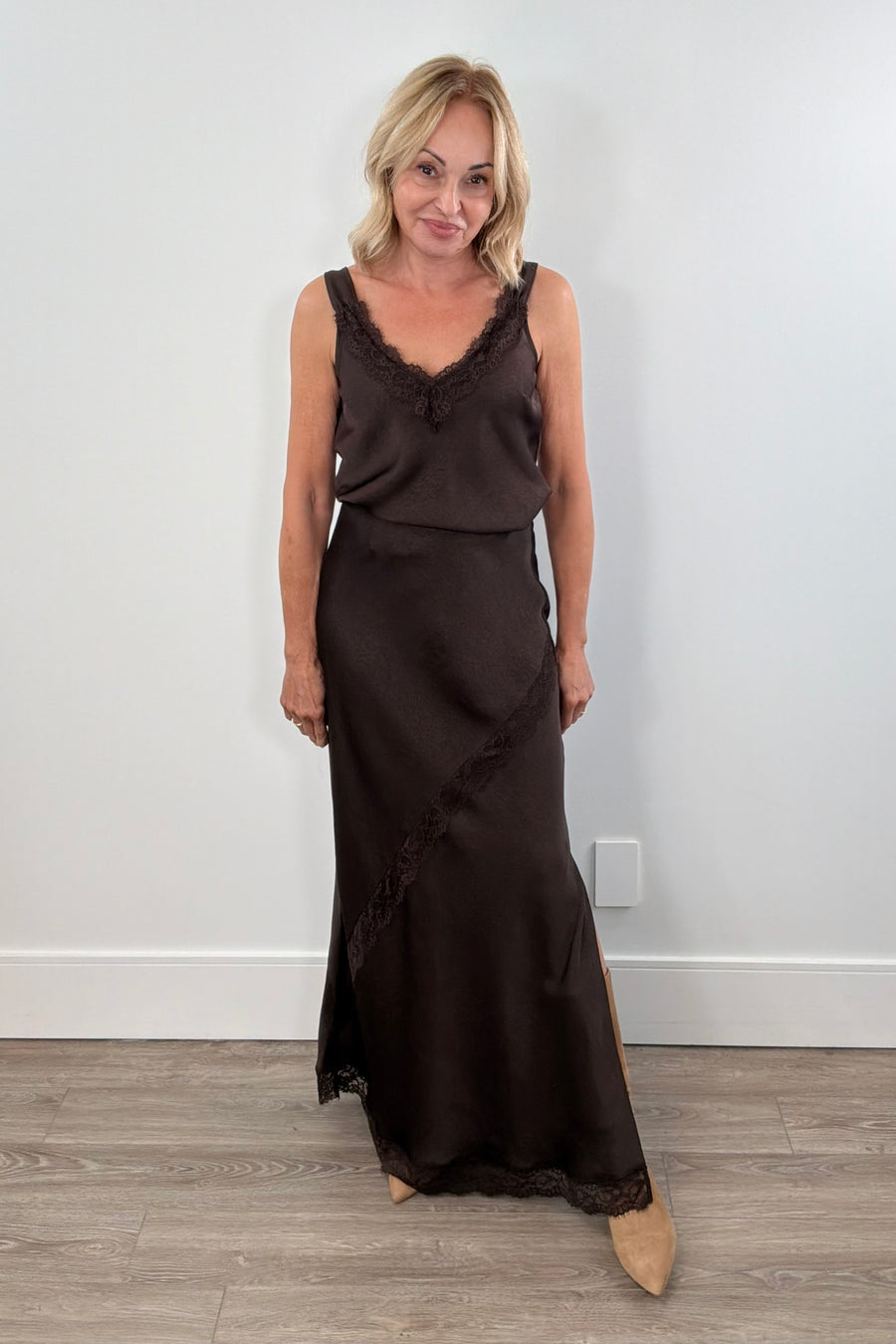 Woman wearing a brown skirt with lace detailing 