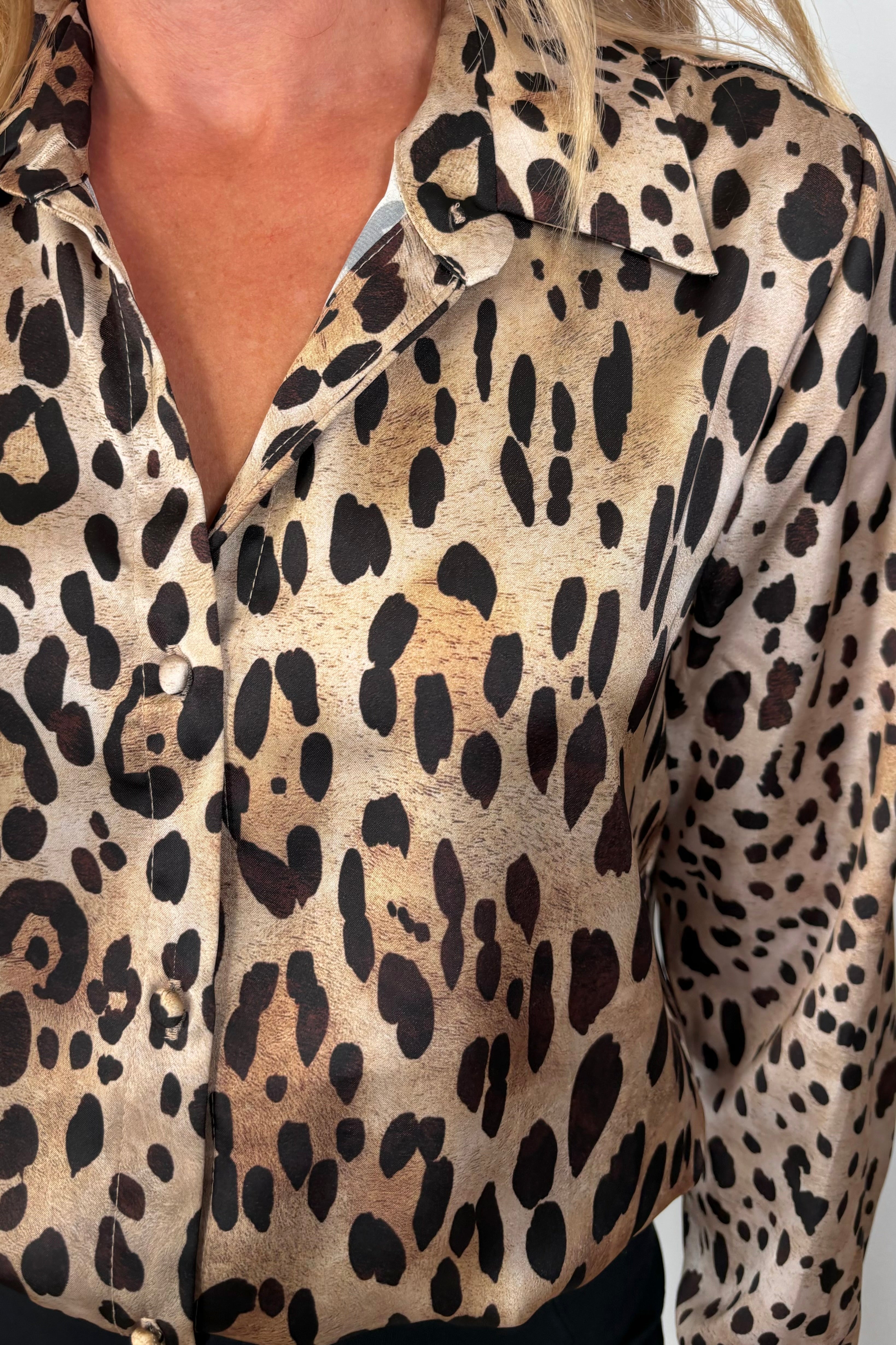 Close-up of a leopard print button down shirt