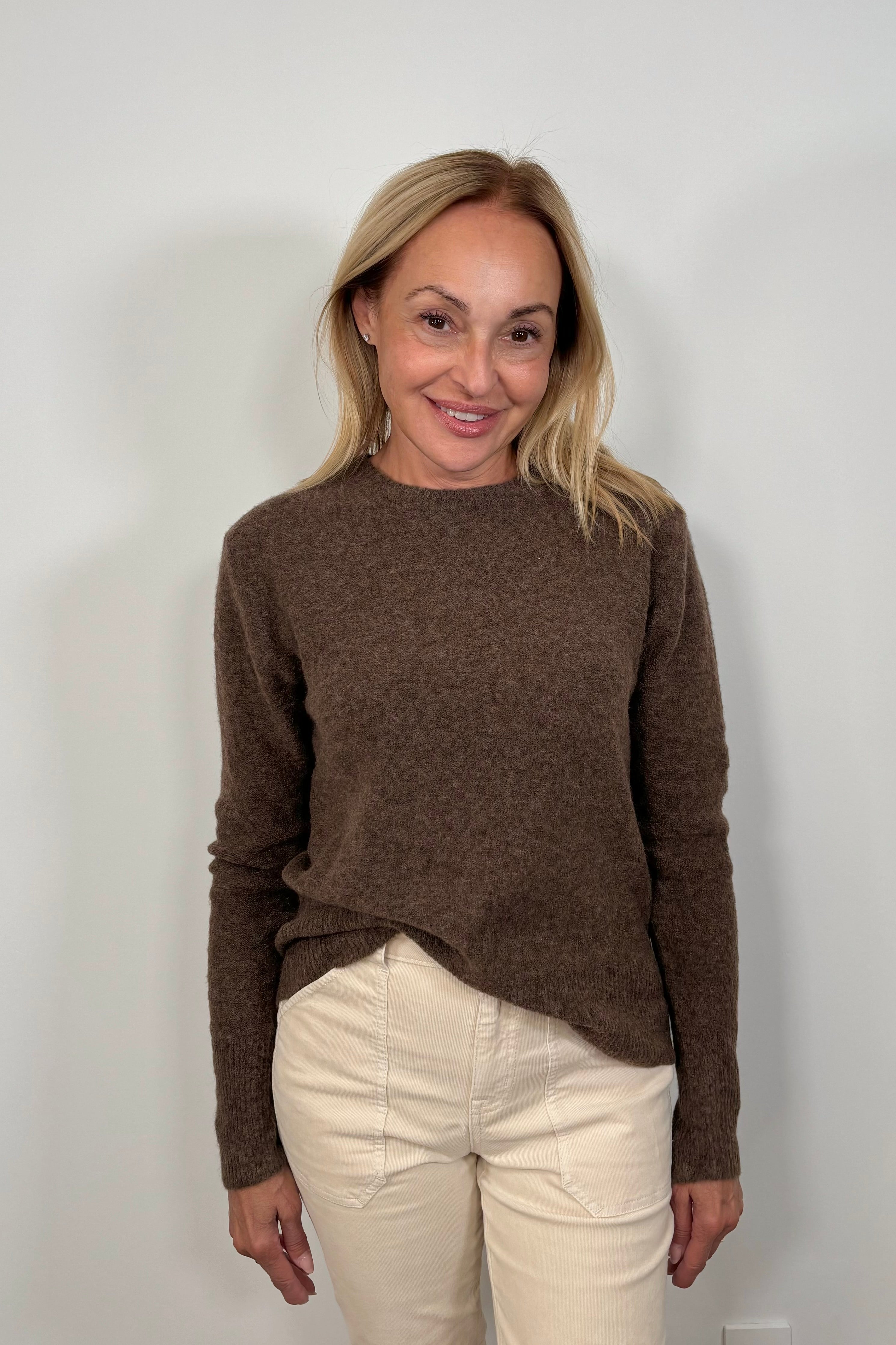 woman wearing a lightweight brown sweater