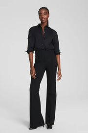 woman wearing a black long flared pants 