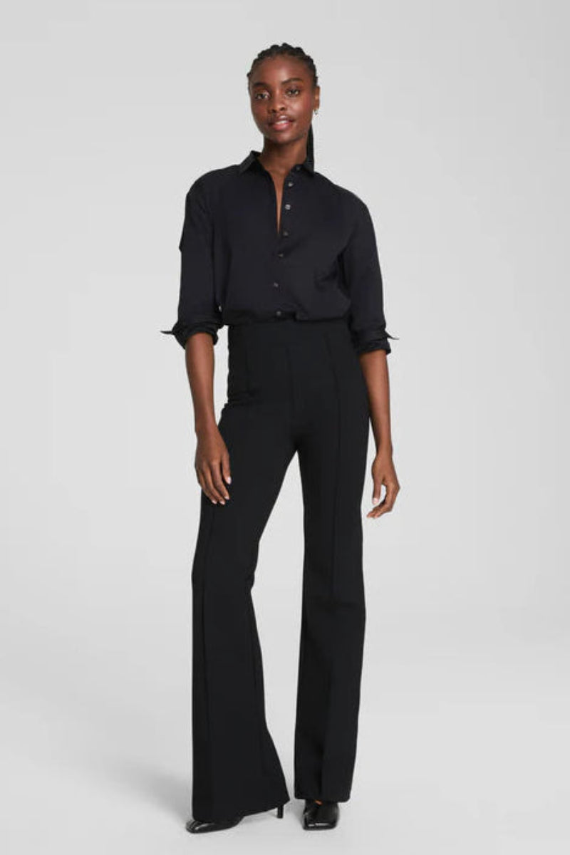 woman wearing a black long flared pants 