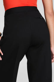 woman wearing black wide leg pants