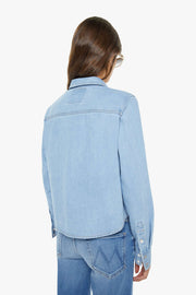 back view of light wash denim collared button up with side pocket