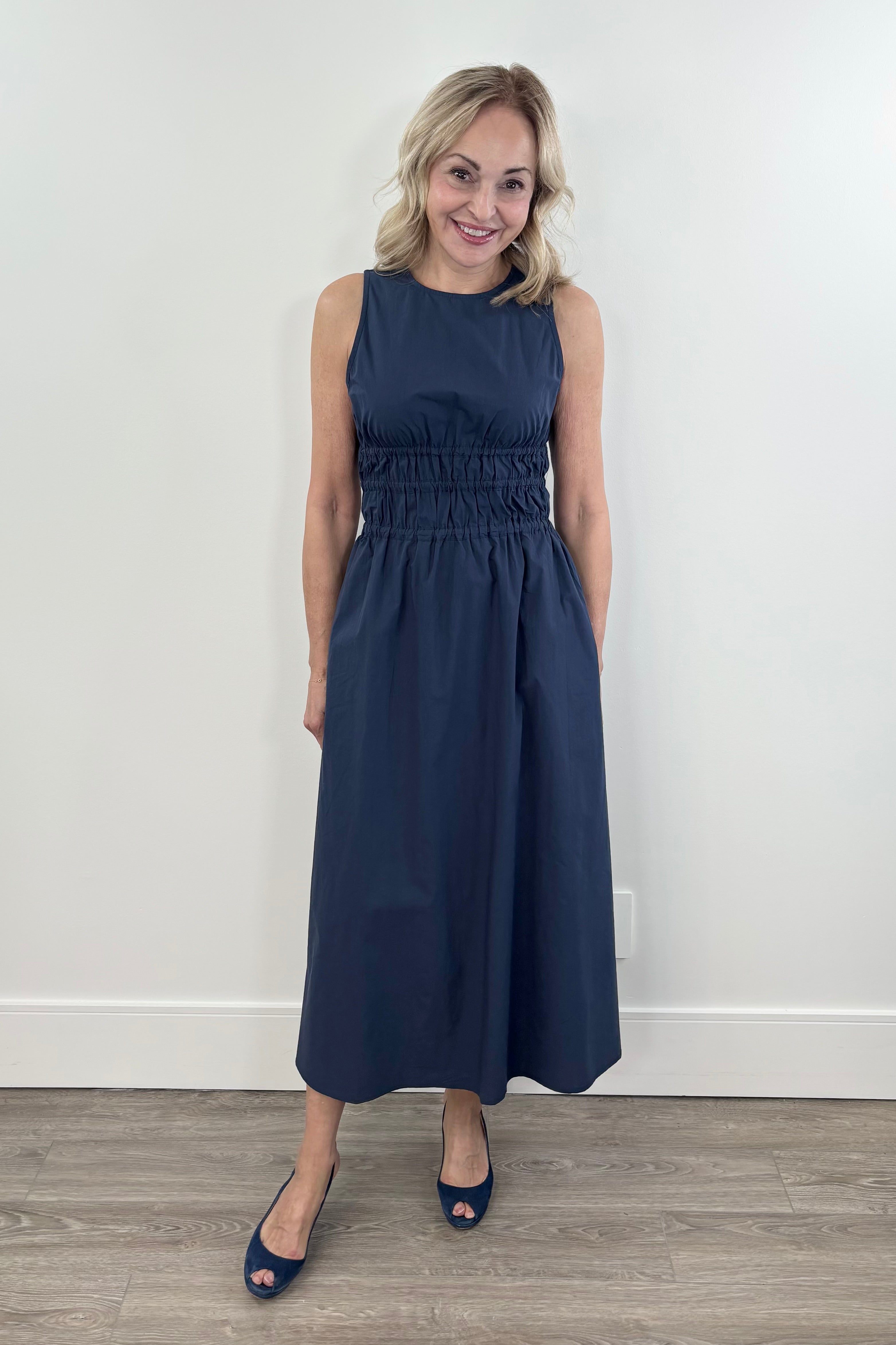 Woman wearing a navy dress