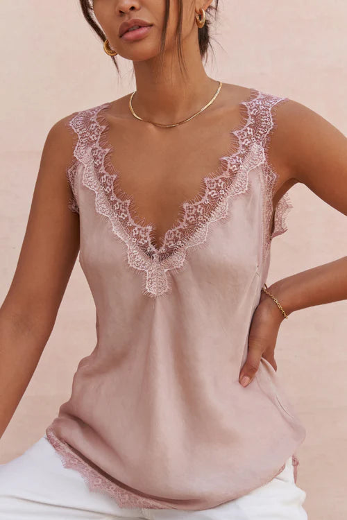 woman wearing a blush sleeveless camisole with lace trim, detail