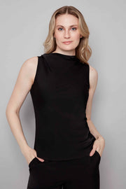 Woman wearing a black sleeveless top against a gray background