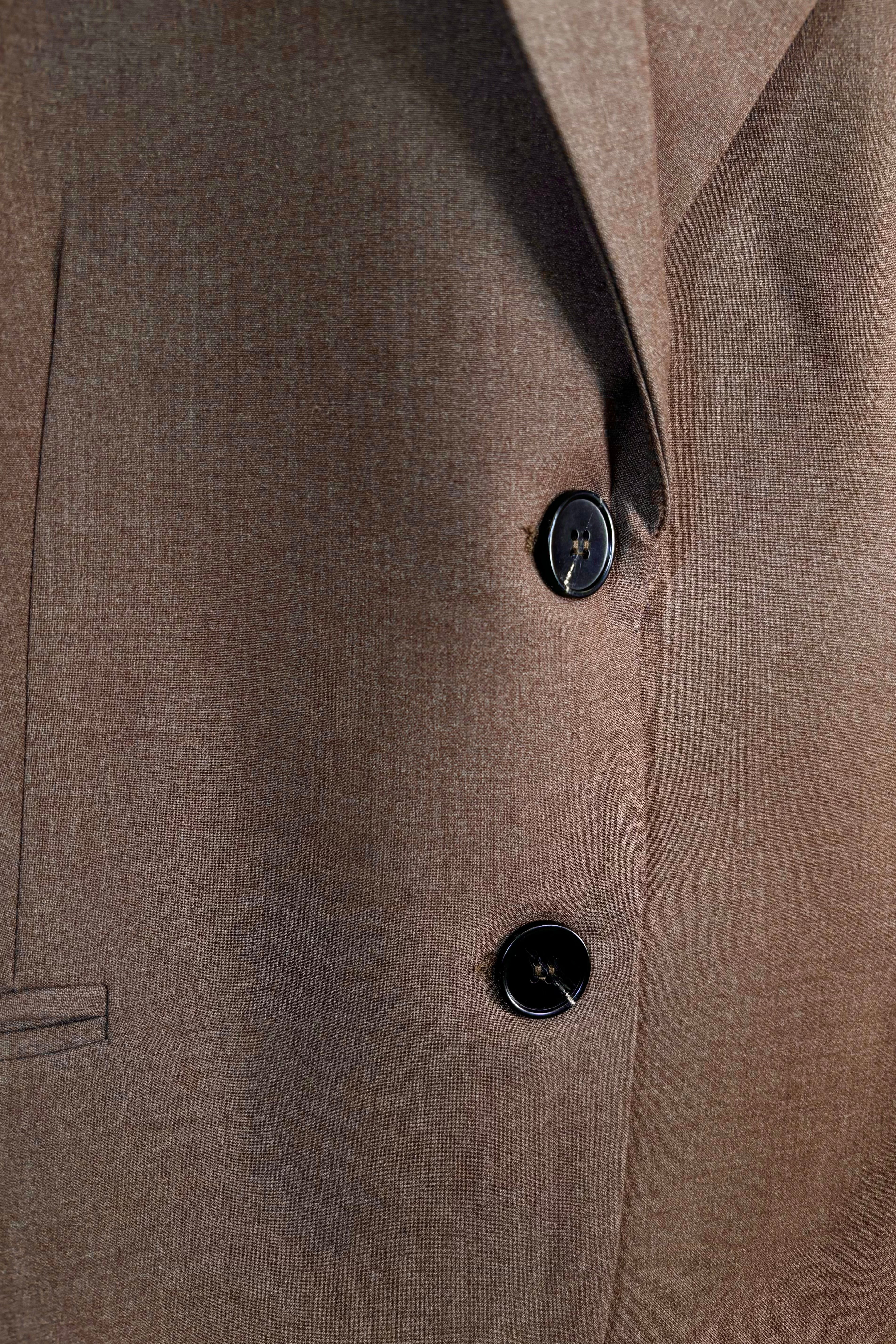 Zoom in of a closed cool brown blazer