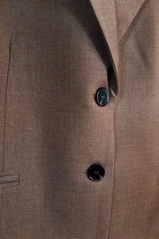 Zoom in of a closed cool brown blazer