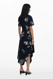 Back view of woman wearing a black floral dress 