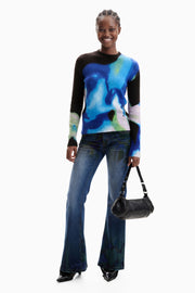 long sleeve pullover with an abstract water color in black, blue, green, and white with a crew neckline. 