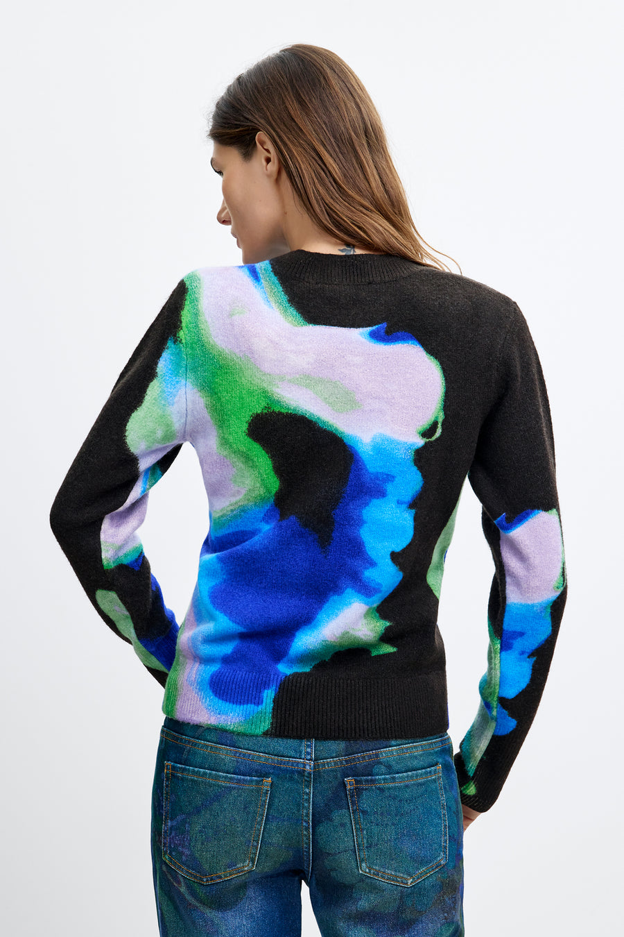 long sleeve pullover with an abstract water color in black, blue, green, and white with a crew neckline. 