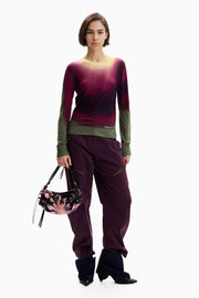 long sleeve lightweight knit sweater featuring an Ombre tie-dye print in pink, green, black, and yellow with a classic crew neckline