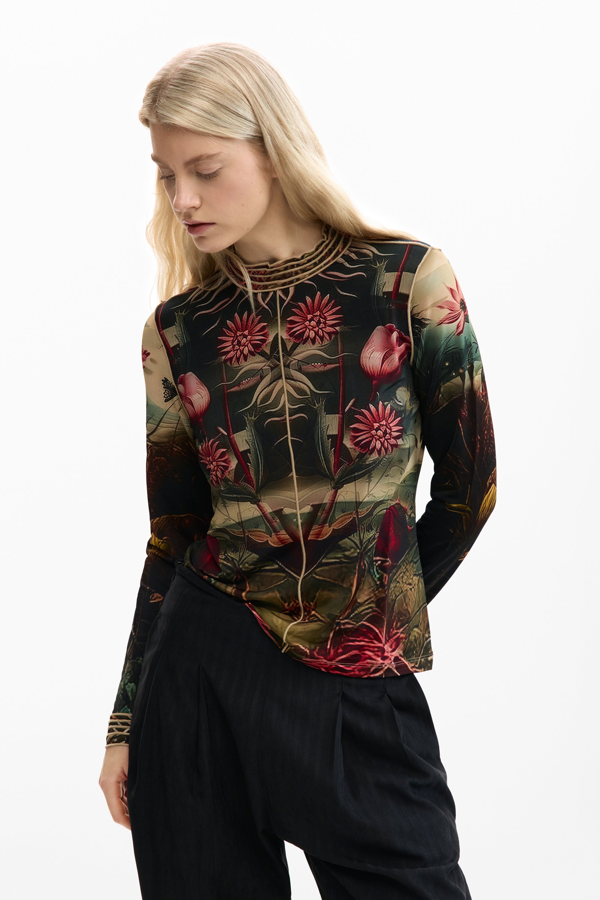 long sleeve mesh top with a vibrant botanical print with colorful florals and foliage on a black background 