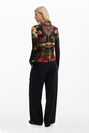 long sleeve mesh top with a vibrant botanical print with colorful florals and foliage on a black background 