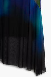 blue watercolor midi slip dress featuring a v-neckline, spaghetti straps, and a sheer mesh asymmetrical hem