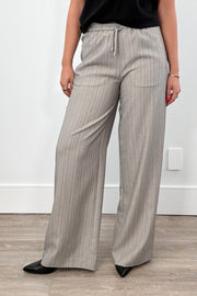 Woman wearing gray pinstripe pants 