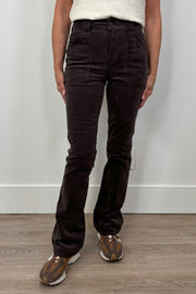 woman wearing a fitted flared corduroy brown pants