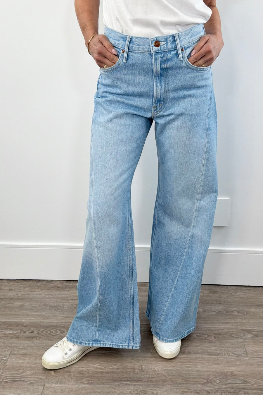 woman wearing light blue washed wide leg denim