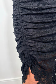 close-up of a long sleeve lined black lace dress