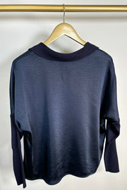 back view of a deep navy long sleeve v-neck top 
