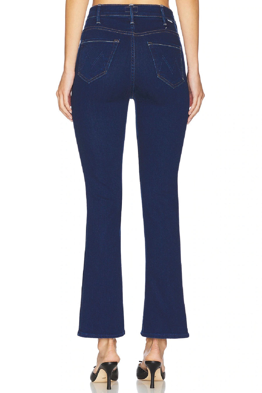 Back view of Woman wearing a dark indigo ankle flare jean