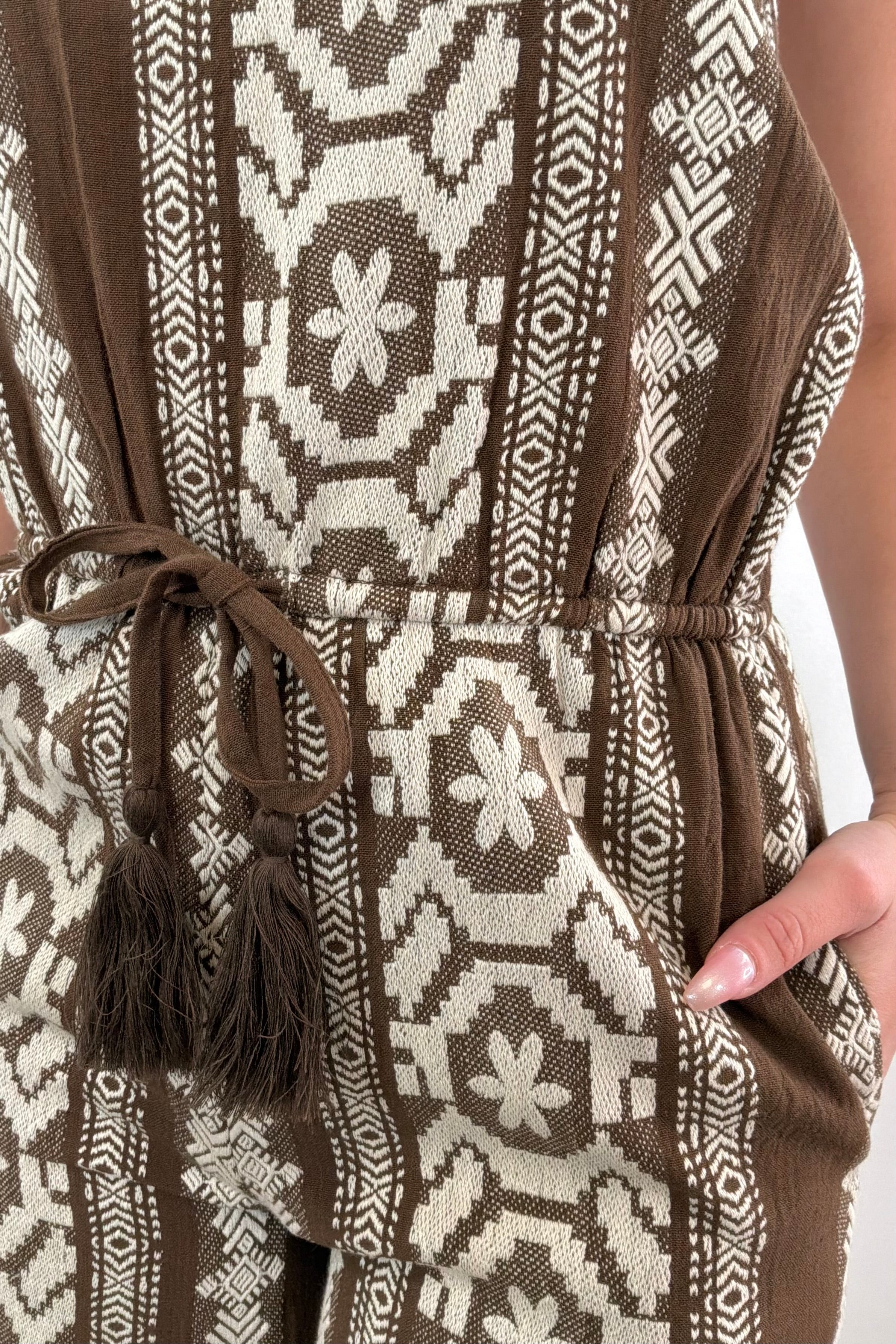 Close up of Woman wearing a strapless patterned jumpsuit 