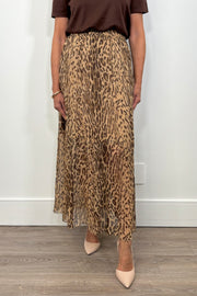 Front view of woman wearing a leopard print maxi skirt