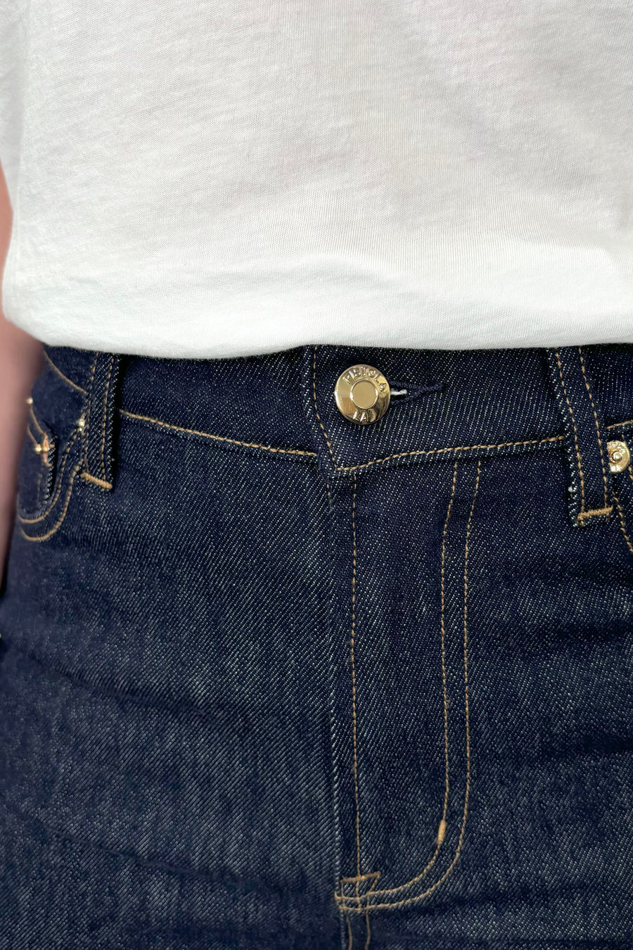 close-up of a dark wash straight keg crop jean