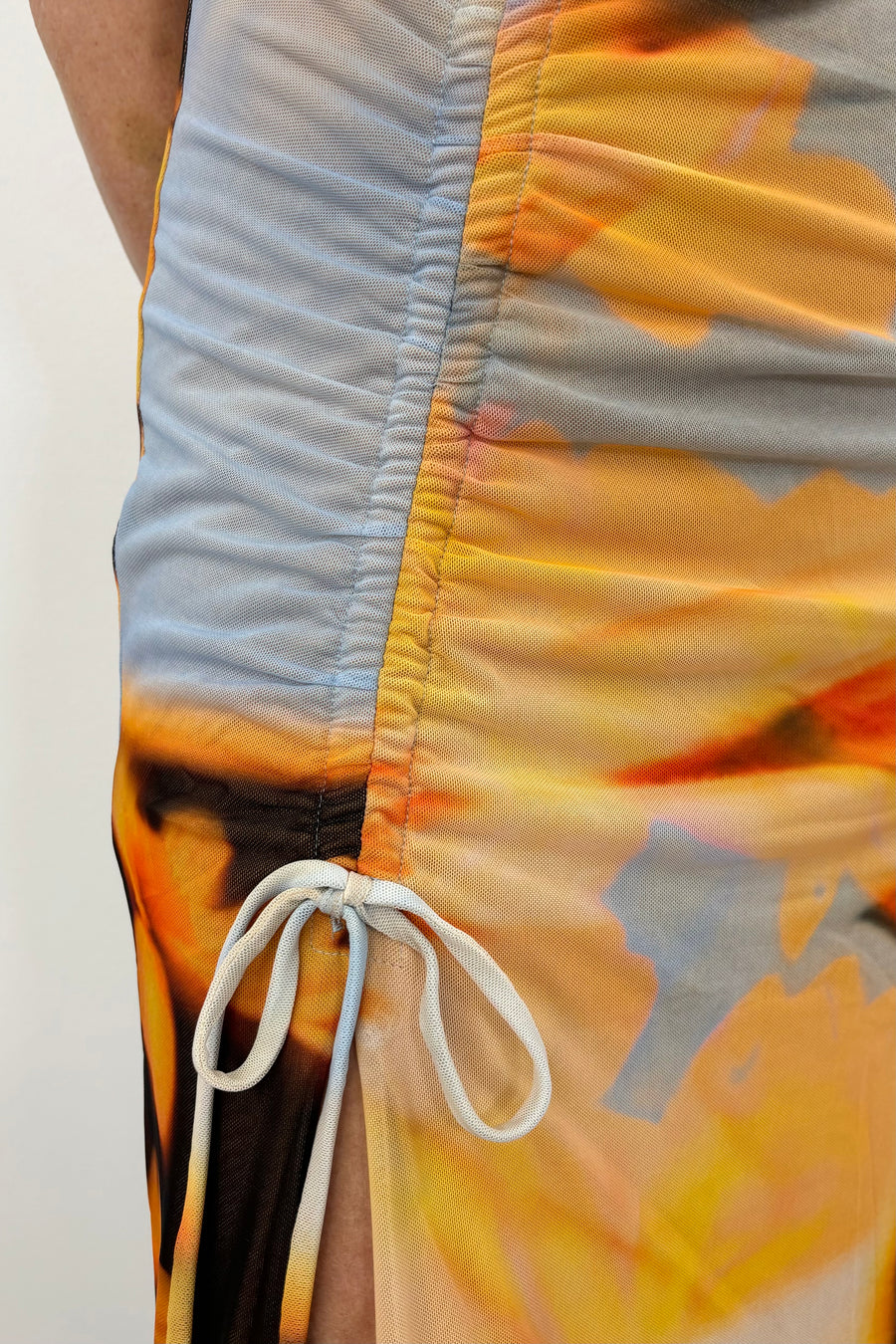 Close up of Woman wearing a light colored floral dress